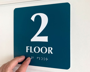 Braille 2nd floor sign