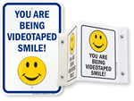 Smile you’re being videotaped signs