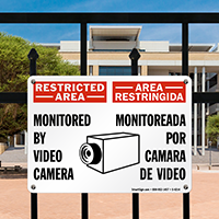 Bilingual Restricted Area Monitored By Video Camera Sign