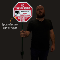 Reflective video surveillance sign for lawn