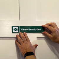 Alarmed Security Sign on a Door