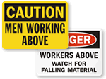 Men Working Above Signs
