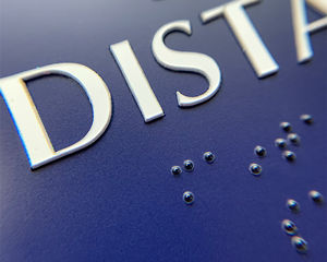 Braille on social distancing sign