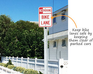 Clear bike lanes with no parking signs