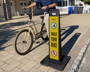 Walk your bike lotboss sign