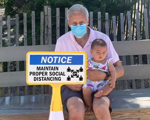 Social distancing sign for traffic cone