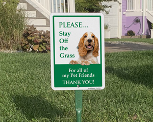 Dogs keep off of the grass signs