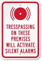 Trespassing On These Premises Will Activate Alarm Sign