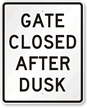 GATE CLOSED AFTER DUSK Sign