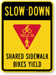 Shared Sidewalk Bikes Yield Slow Down Sign