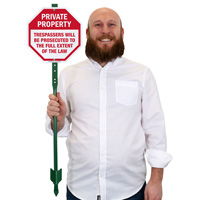 Trespassers will be prosecuted lawnboss sign