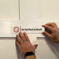 Do Not Pipet By Mouth Sign on a Door