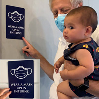 Braille mask required upon entering sign