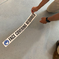 Wear face covering floor marker