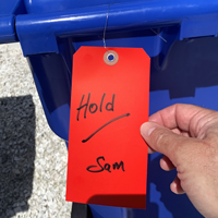 Red plastic tag with wire